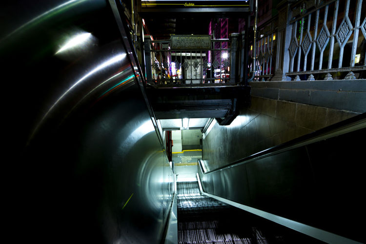 High angle view of illuminated escalator