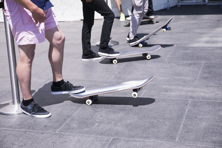 Low section of men with skateboard