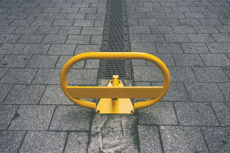 High angle view of yellow barricade on street