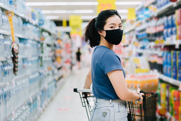 Full length of woman standing in store