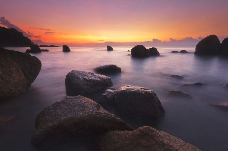 Scenic view of sea against sky during sunset