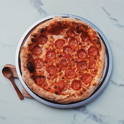 High angle view of pizza in glass on table