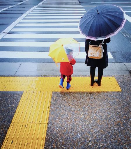 Woman walking on road