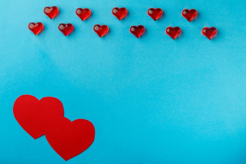Directly above shot of heart shapes on blue background