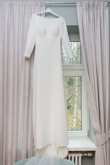 White clothes hanging on window