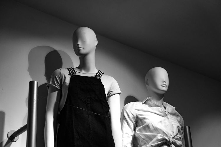Low angle view of female sculpture at store
