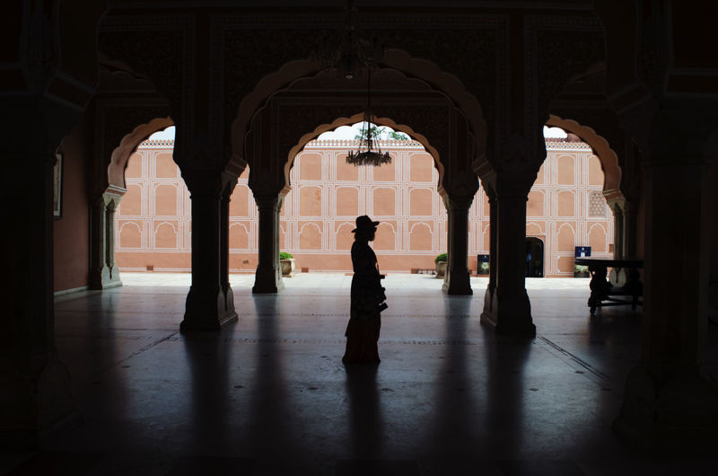 Silhouette woman standing in corridor of building