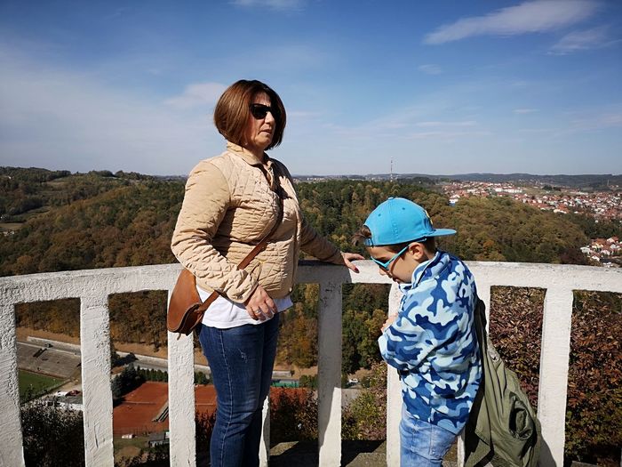 Mother and son standing at observation point