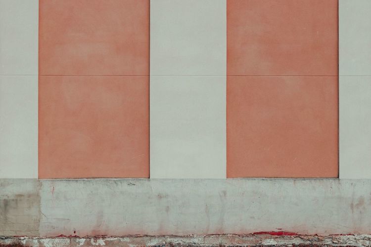 A coloured wall of a building