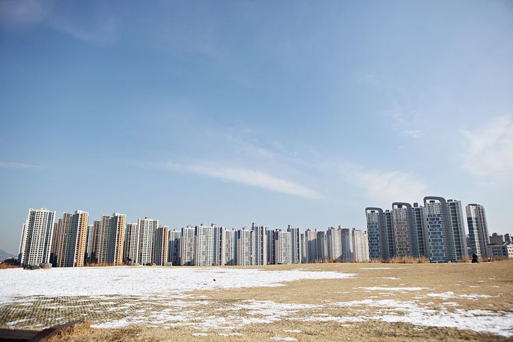 Panoramic shot of modern buildings against sky