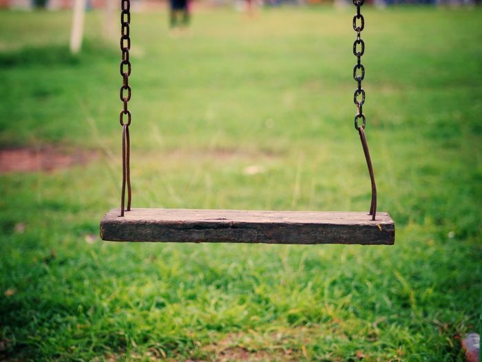 Close-up of swing on playground