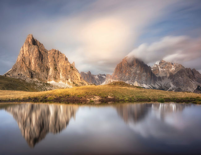 Scenic view of lake and mountains against sky