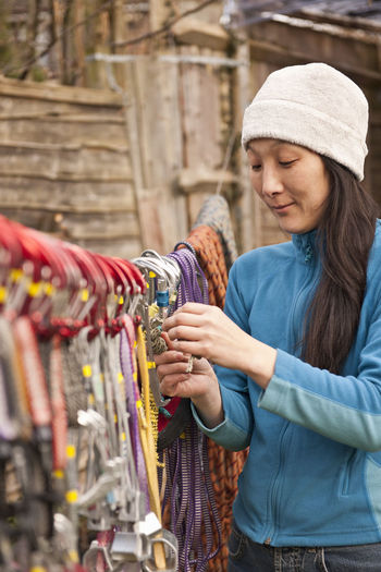 Woman hanging up climbing gear to dry out