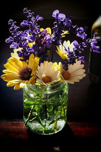 High angle view of flowers in glass vase on table