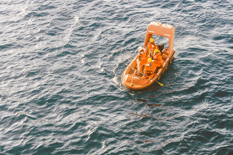 High angle view of people in boat at sea
