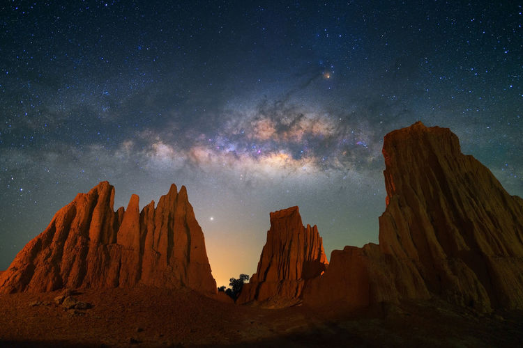 Panoramic view of rock formations at night