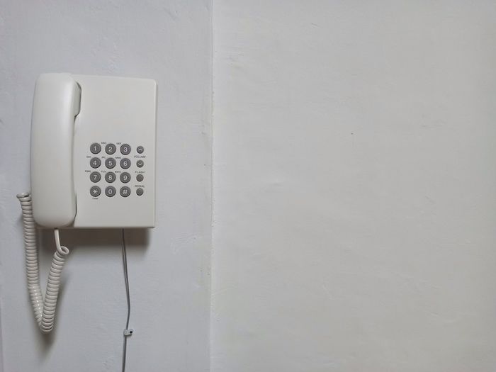 Close-up of telephone on wall