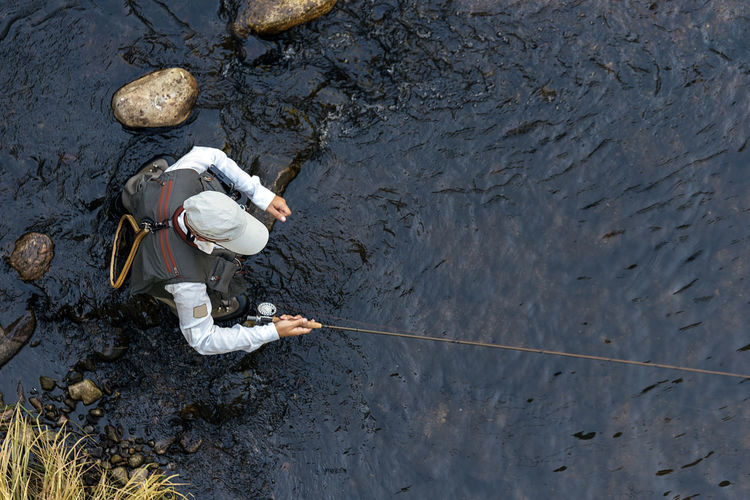 High angle view of person working on riverbank