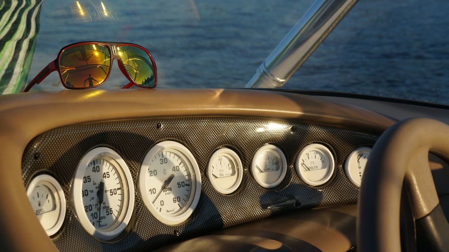 Close-up of vintage dashboard on sea