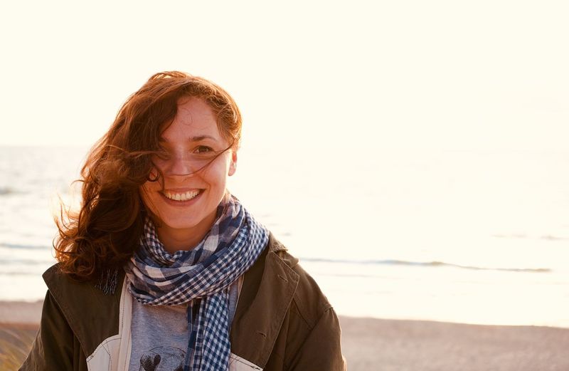 Portrait of smiling woman at beach