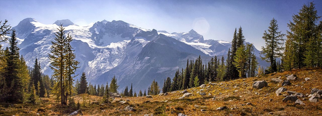 Scenic view of mountains against cloudy sky