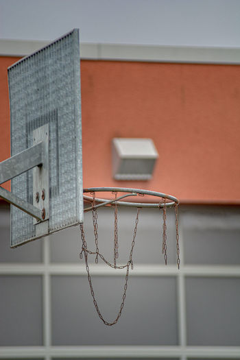 Low angle view of basketball hoop against building