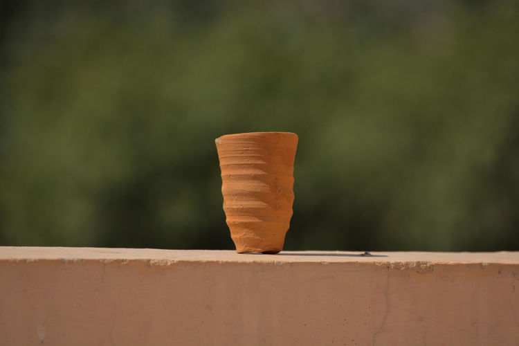 Cup made of mud sand called kulhad kullhad used to serve authentic indian drinks structure on wall