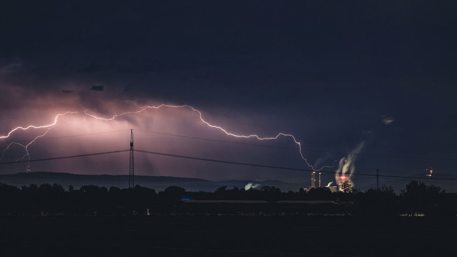 Low angle view of lightning in sky at night