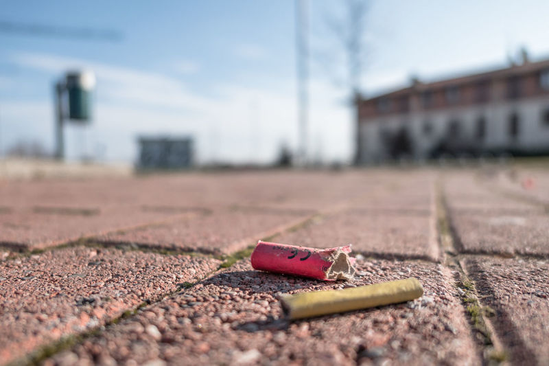 Close-up of cigarette on city street