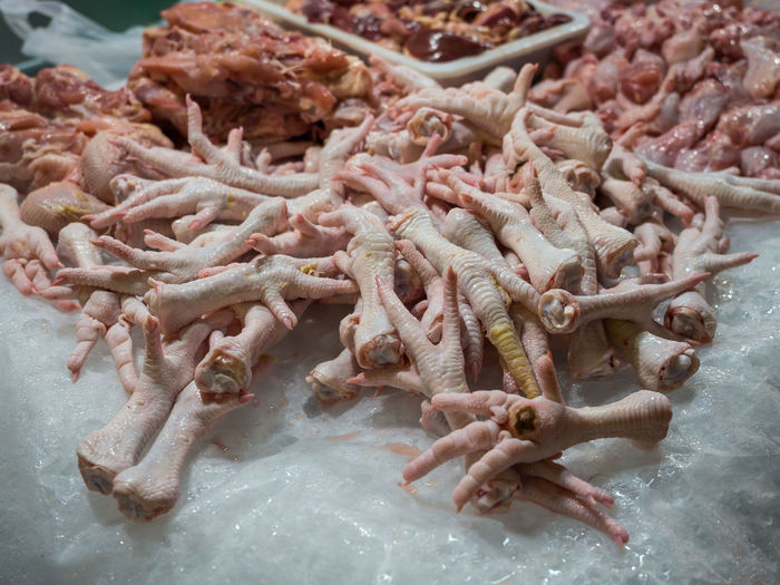High angle view of chicken feet for sale in market