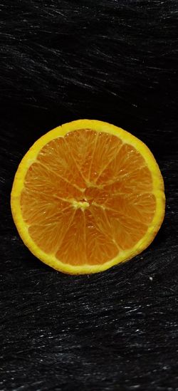 Close-up of lemon slices on black background