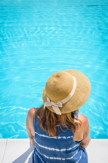 Rear view of woman at swimming pool