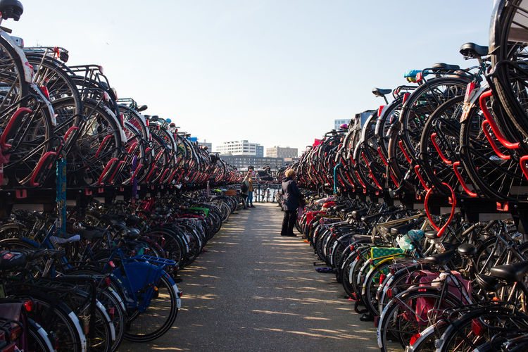 Bicycles on racks against clear sky