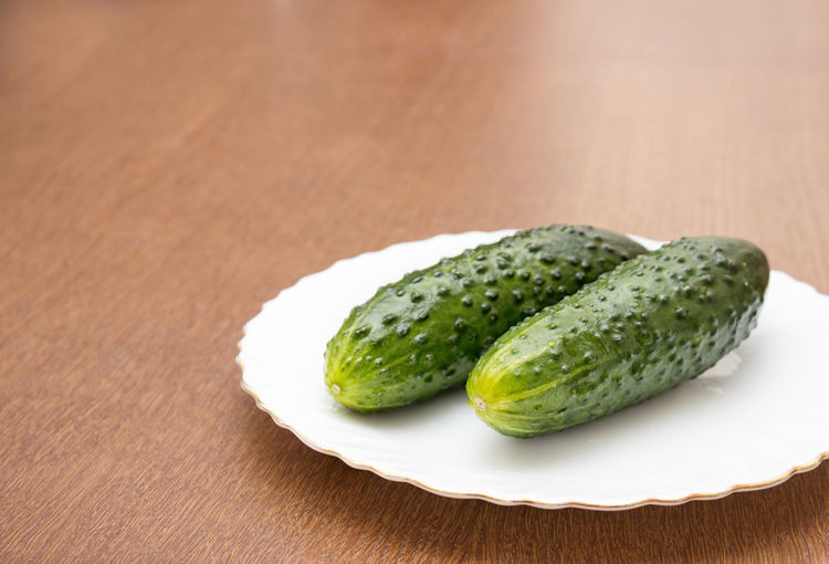 Close-up of cucumber in plate on table