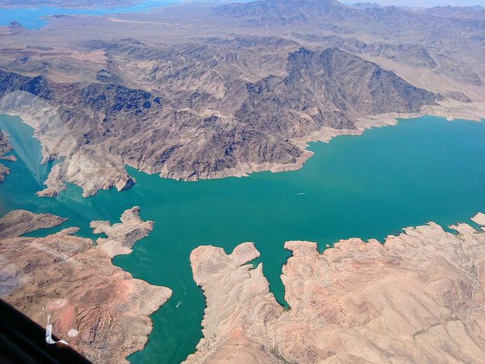 High angle view of lake by mountain
