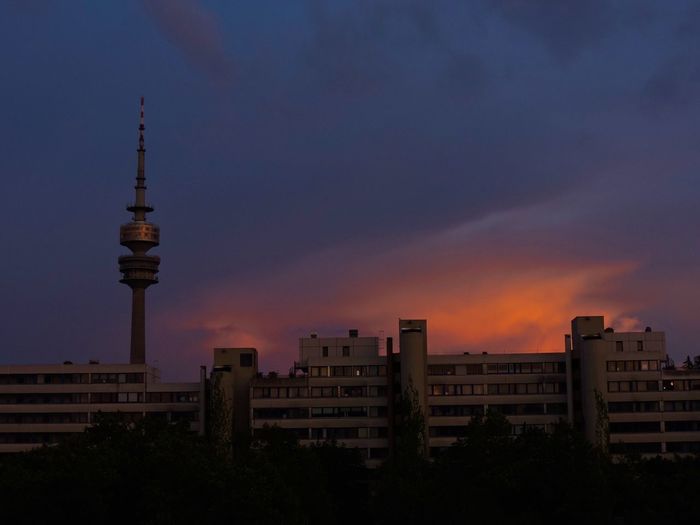 Communications tower against sky at sunset