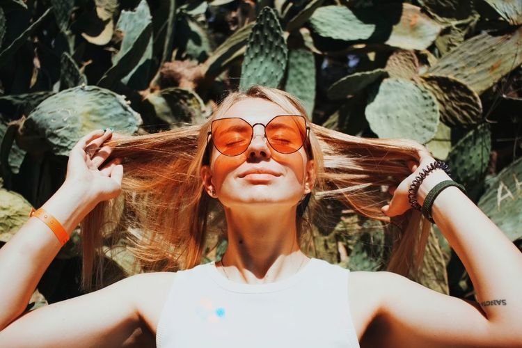 Portrait of young woman wearing sunglasses