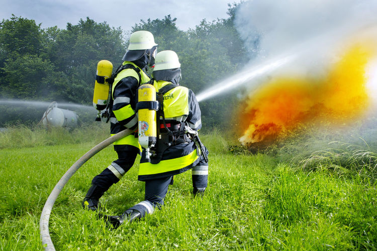 Fire brigade extinguishing fire