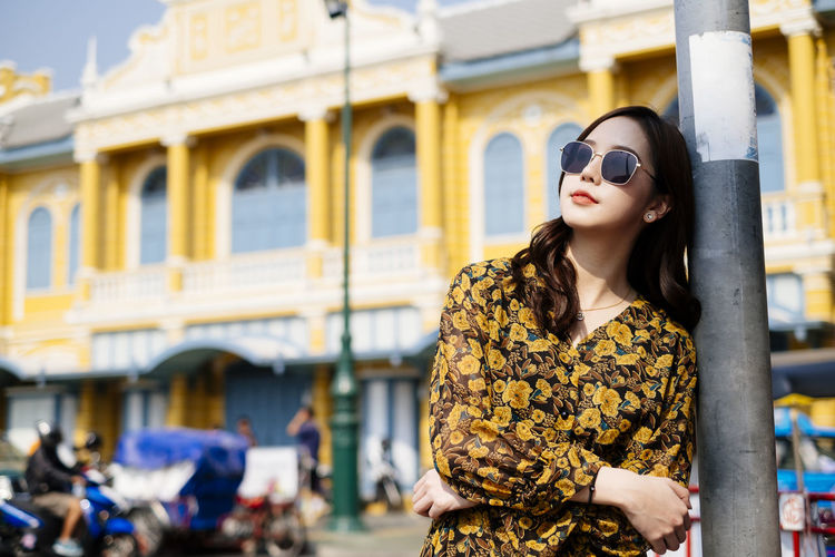 Woman wearing sunglasses standing outdoors