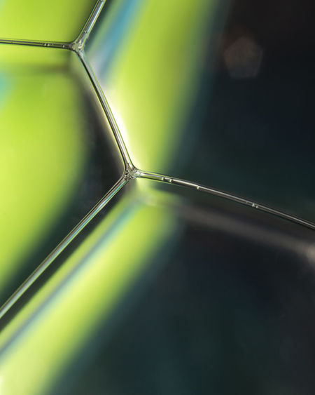 CLOSE-UP OF GLASS CONTAINER ON TABLE
