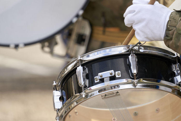 Close-up of man playing drum
