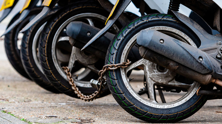 Close-up of motorcycle on road