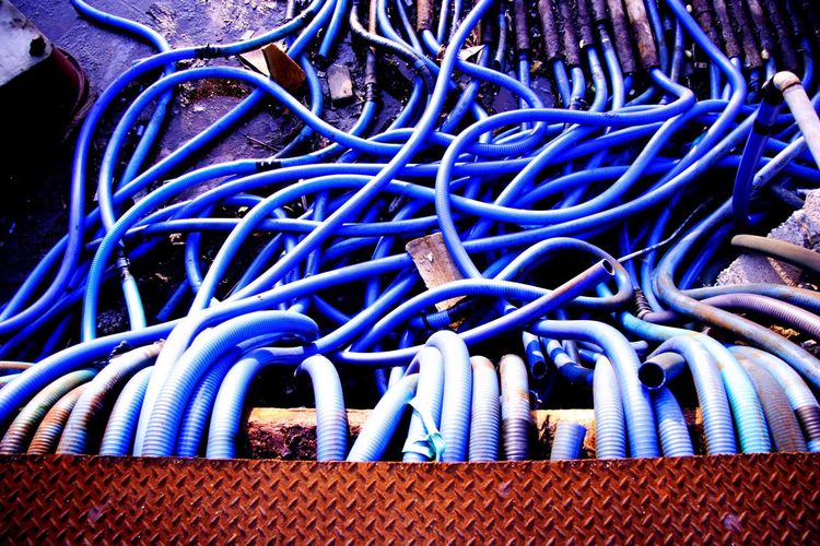 Close-up of cables against blue sky