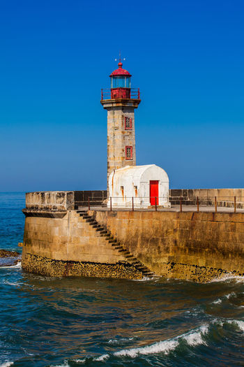 Historical felgueiras lighthouse built on 1886 and located at douro river mouth in porto city