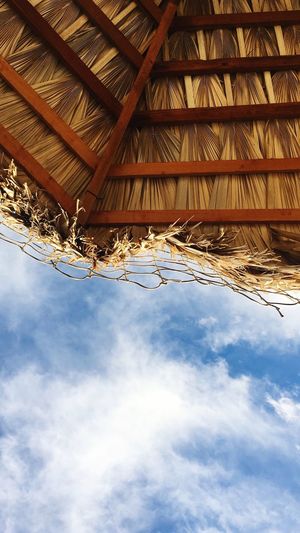 Low angle view of roof against sky