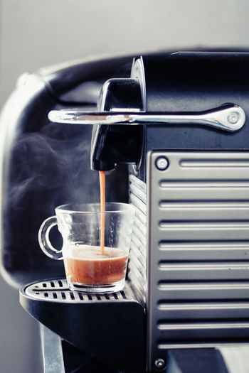 Close up shot of coffee machine making hot espresso