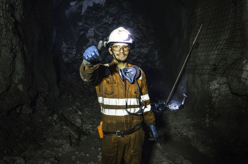 Portrait of man standing in tunnel
