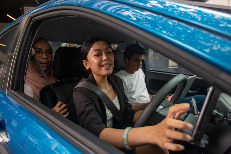 People sitting in car