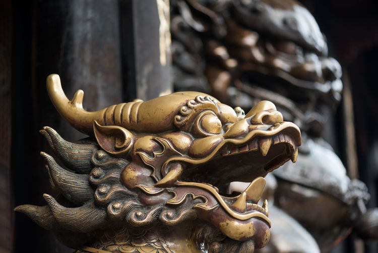 Close-up of metal sculpture at temple