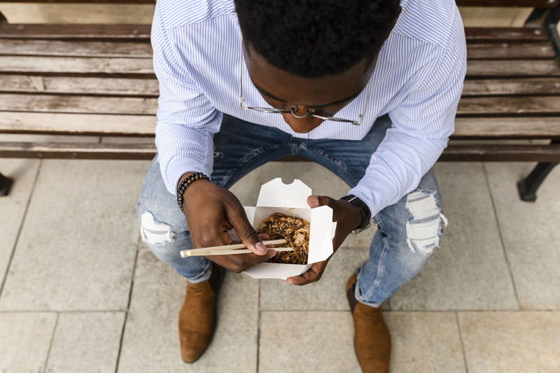 High angle view of man holding food